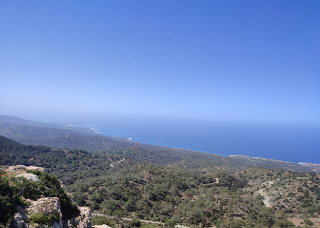 Vista from Pissouromoutti peak in Akamas towards the north west, the bay of Polis Chrysochous. There is relatively dense juniper vegetation.