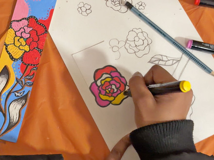 Hand coloring a rose drawing and floral patterns