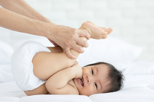 close-up-mother-hands-holding-baby-leg-exercise-healthy-bed-smiling-happiness-emotional-co