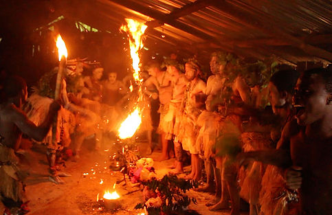 Participants gathered around a fire during a Bwiti ceremony.