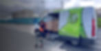 Courier loading packages into a delivery van