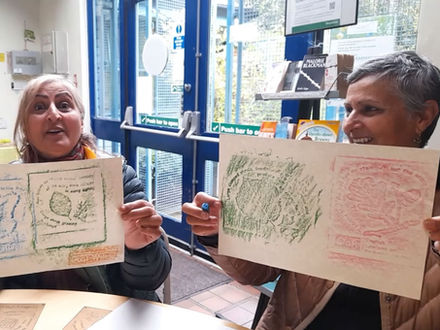 Women at a wellness retreat creating abstract art