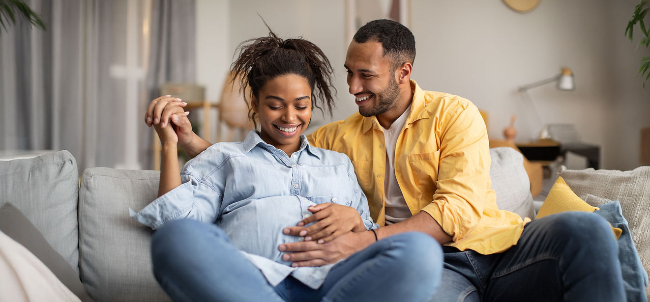 Couple forming a bond with their unborn baby through Prenatal Bonding