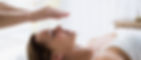 therapist-performing-reiki-woman