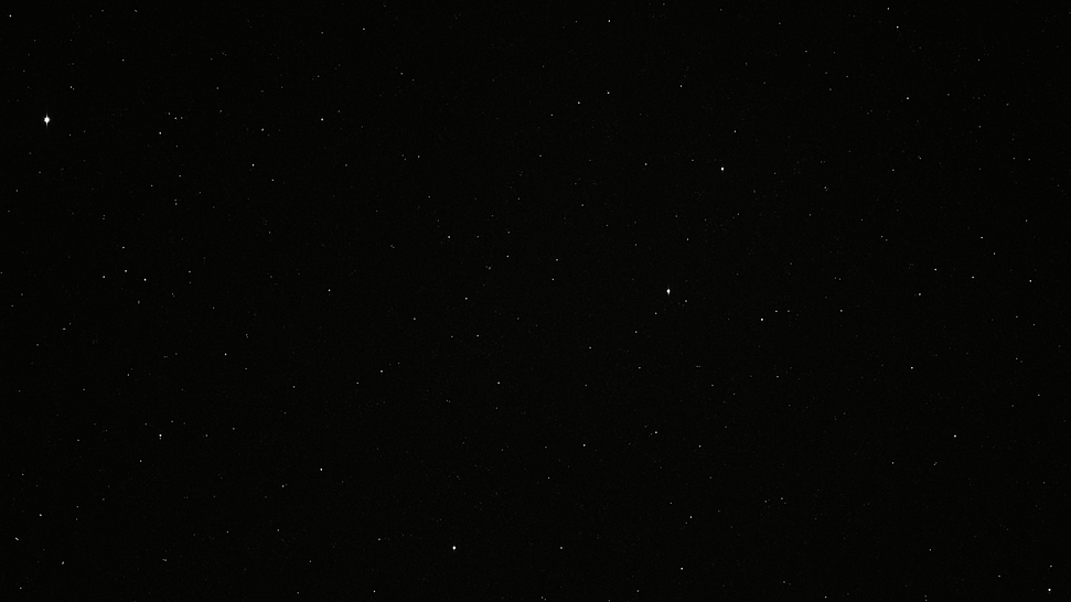 A dark starry black void that represents entering the status quo of American business and work culture.