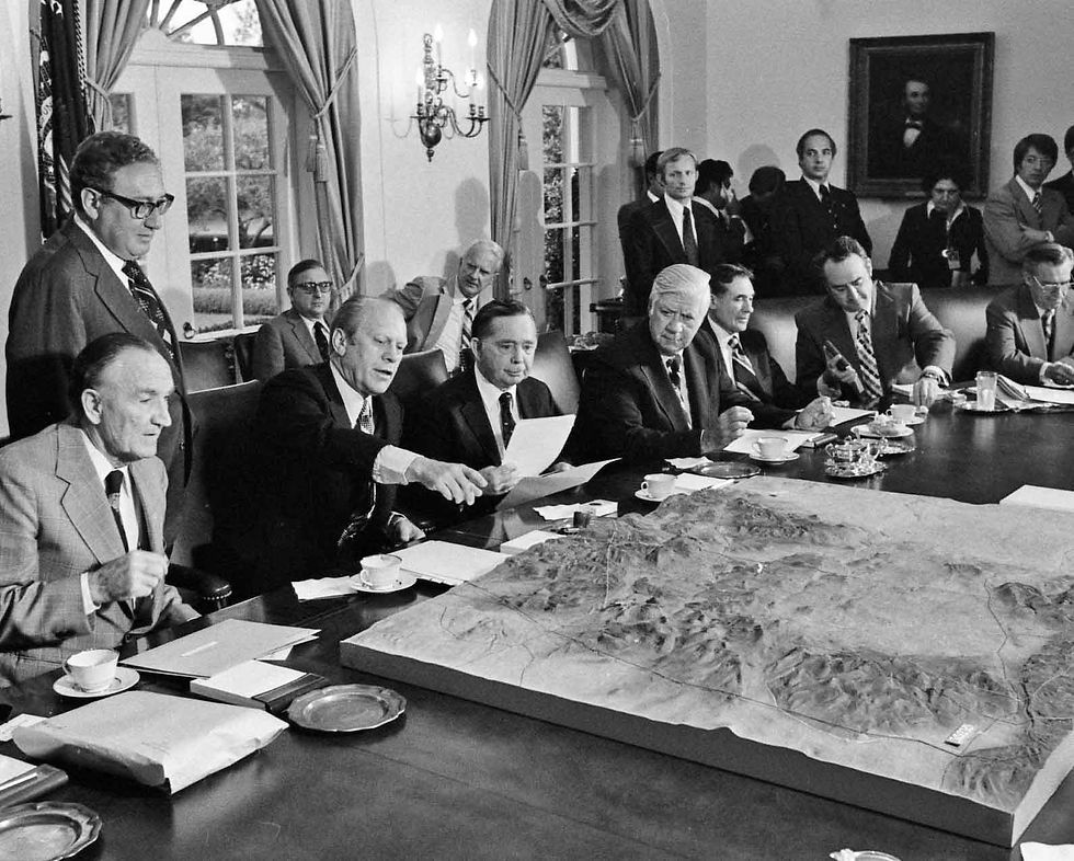 Gerald Ford (pointing) and Henry Kissinger (standing) sought to use American leverage to press Israel towards a wider Middle East settlement in 1975, provoking a powerful backlash on Capitol Hill.