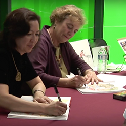 Cynthia Chin-Lee Lea Lyon illustrator signing books of Operation Marriage