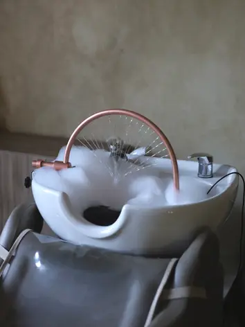 Luxury head spa chair with shampoo bowl in salon