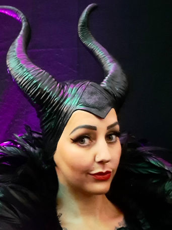 Maleficent inspired children's entertainment character against a purple background