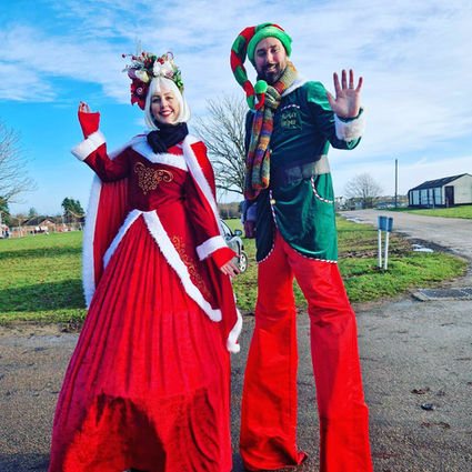 Mrs Claus and Elf stilt walkers.jpg