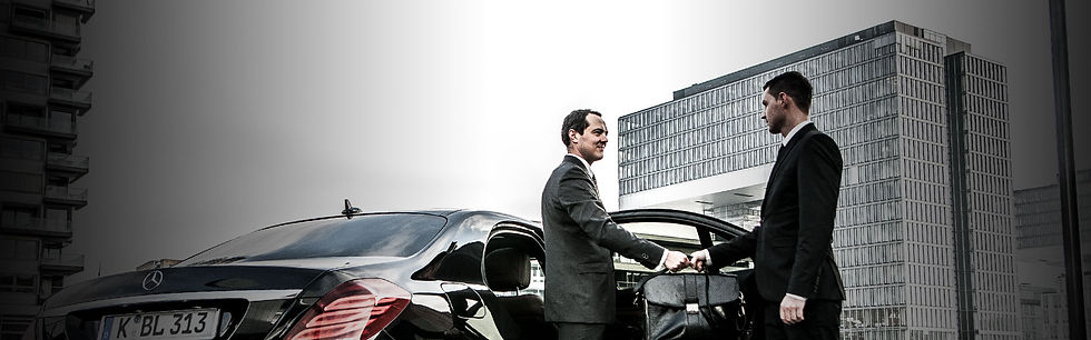 bl-slider-chauffeur-passing-briefcase-to-businessman.jpg