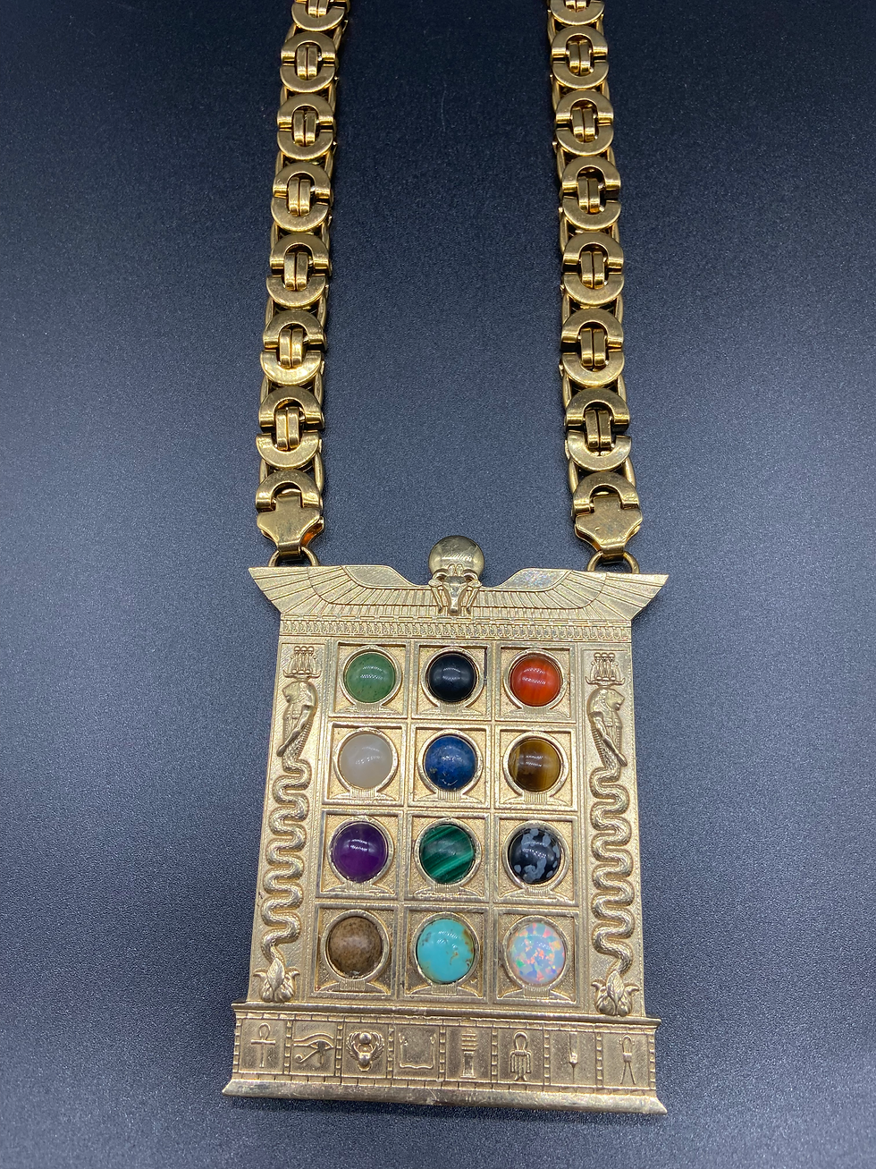 Close-up view of traditional African gold necklace with intricate patterns