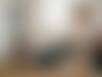 Pilates instructor observing and assessing client movement during a reformer session at Body Form Education.