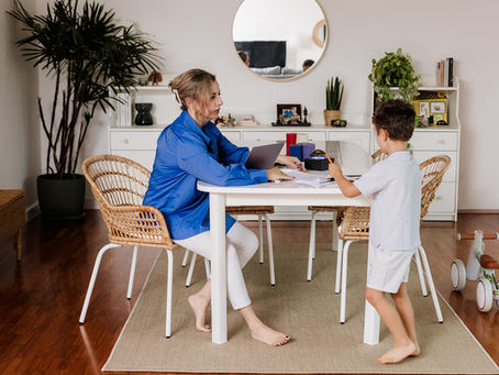 Pinar Koyuncu Oktar working on the table with her son Ege Kemal Oktar