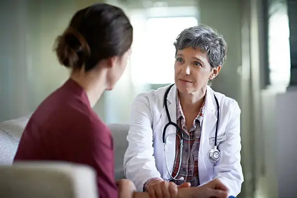 Image of a doctor engaged in a discussion with a patient, focusing on anxiety management.