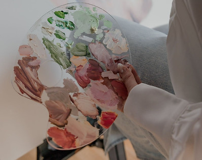 Artist holding paint palette.