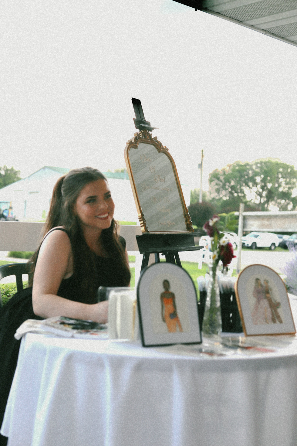Painting wedding guest illustrations during reception.