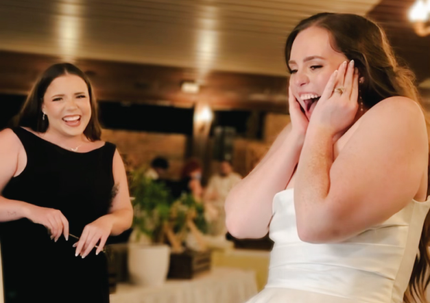 Bride reaction to wedding painting at the end of the night.