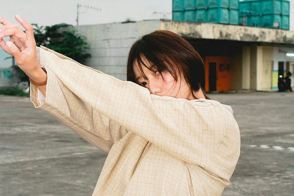 woman holding hands up