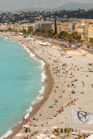 a beach filled with people in Nice