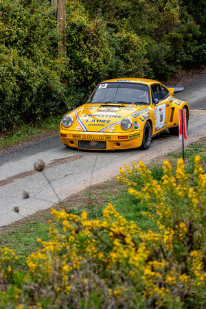 a yellow race car with the number 30 on the front