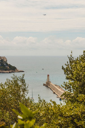 a lighthouse in Nice in the middle of a body of water