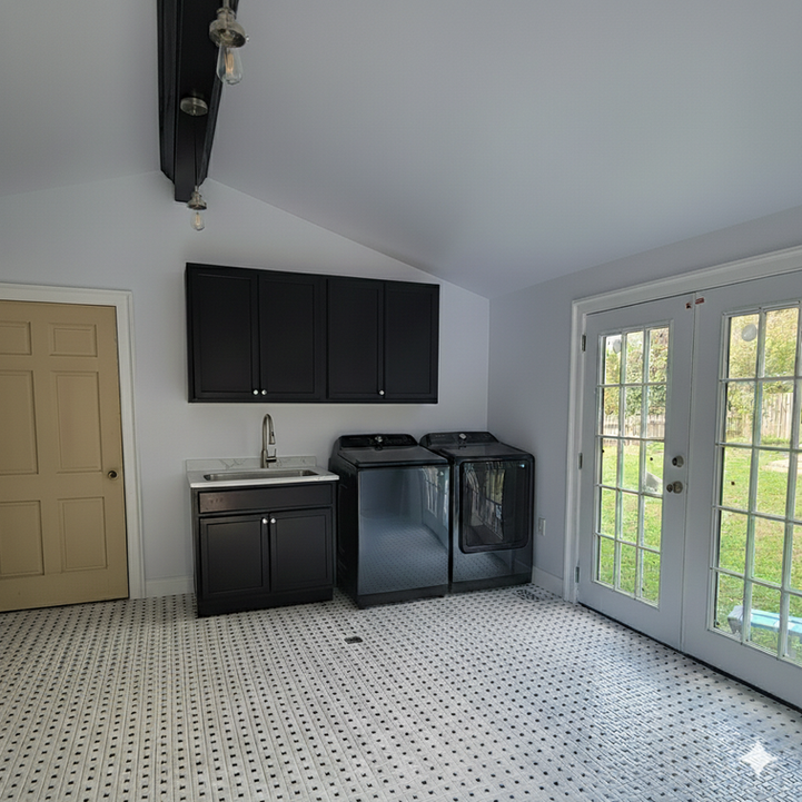 Den conversion with vaulted ceiling, tile floor, added plumbing, and French doors bringing in natural light