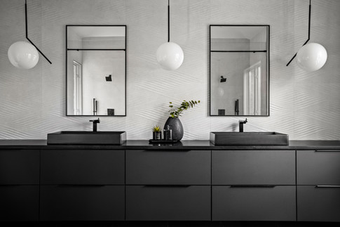 Spa-like primary bathroom with strategic lighting and timeless finishes enhancing property appeal