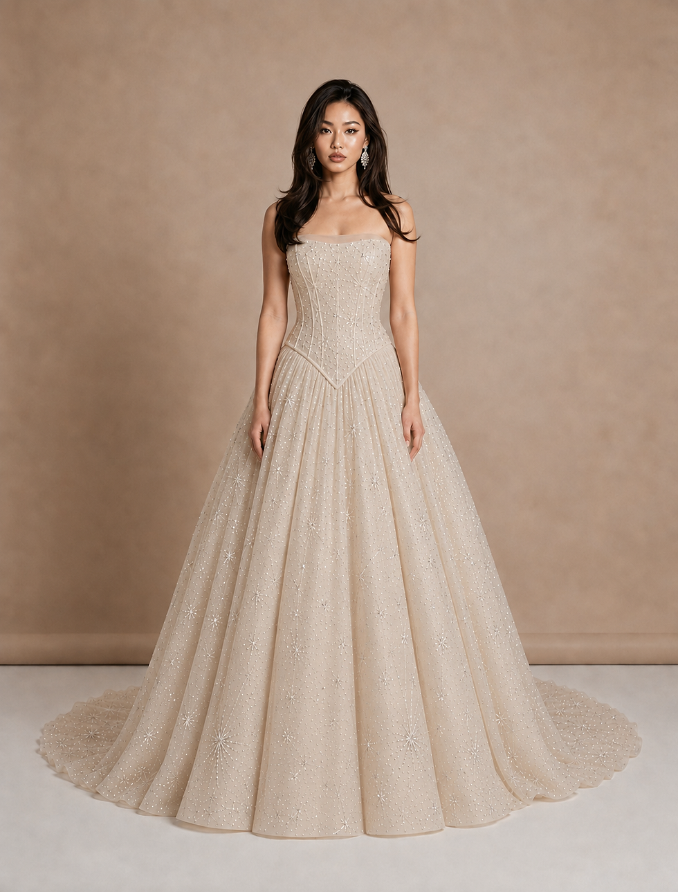 Front-view 3D simulation of a warm-ivory strapless basque-waist ball gown with medium-density celestial star embroidery across the corset, full tulle skirt, and train.