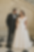 Plus size bride in custom made-to-measure off-the-shoulder A-line wedding dress with structured bodice and full skirt