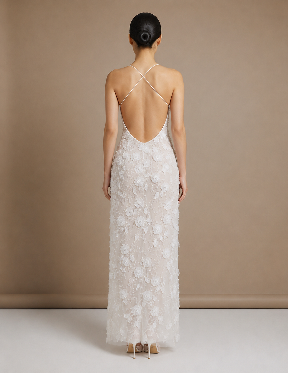 Studio RÉN realistic 3D bridal simulation inspired by Anne Hathaway’s 2013 Prada Oscar dress, shown from the back in an ivory floral appliqué column wedding gown with a low open back, delicate crossed straps, fitted silhouette, and slim heel bridal shoes.
