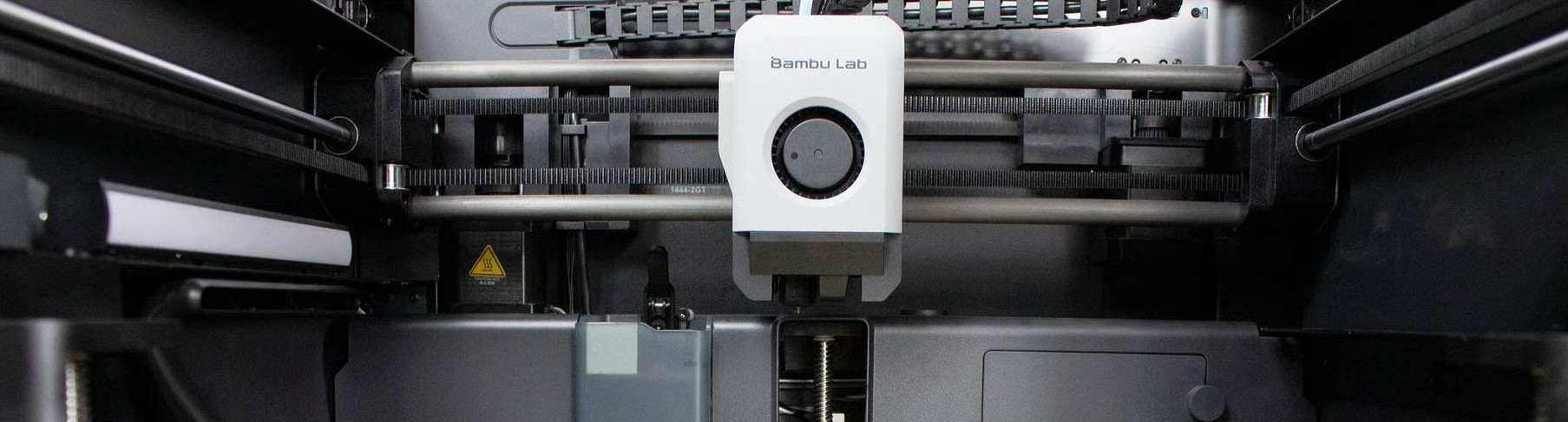 Inside one of our Bambu Labs 3D printers waiting for its next project