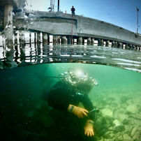 Awesome shot of an inspection diver using Outland Technology commercial dive equipment (light and camera) from Myers Marine Division.