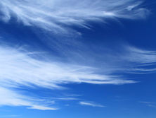 Criss-crossing cirrus clouds in blue sky