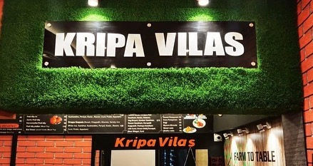 a restaurant with a sign that says kripa vilas