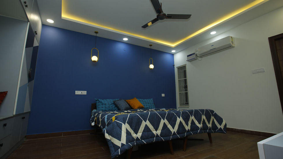 a bedroom with a bed and a ceiling fan