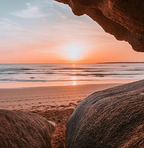 sun-seen-through-cliffs-beach.jpg