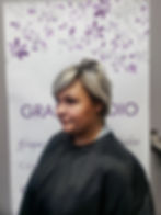 Client with short gray natural hair before a Signature Braidless Sew-In hair extension installation.