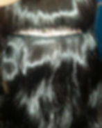 Close-up of a Signature Braidless Sew-In using ultra-thin Genius Wefts installed on a beaded foundation for a flat, seamless, natural-looking finish.