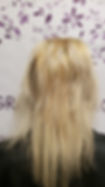 Client with blonde hair before a Signature Braidless Sew-In using 22-inch straight Asian human hair extensions professionally color matched for a seamless installation.