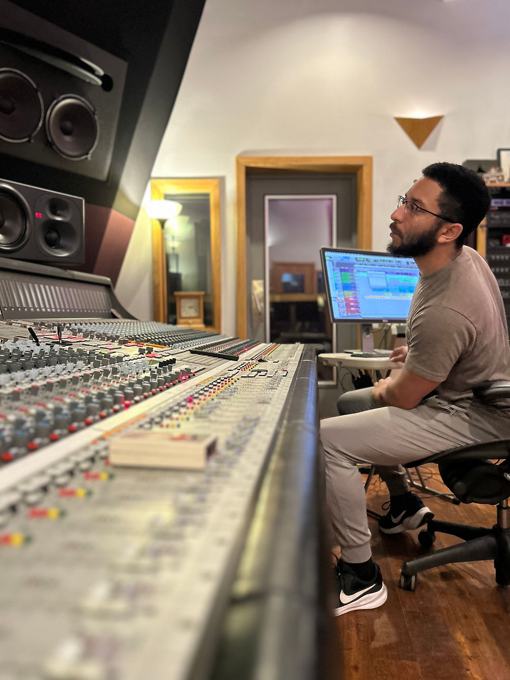 Recording Mixing Engineer at a studio mixing console