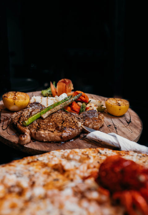 Steak rib eye and lobster pizza food by M tulum lounge