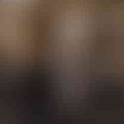 People passing in front of a facade of a coffee shop called cortado in paris