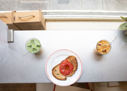 Overhead view of toast, matcha, and iced coffee
