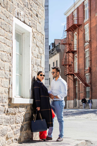 Couple chatting on Parisian street, stylish attire