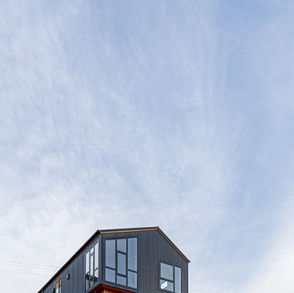 exterior photograph of corrugated metal cladding and timber board and batten cladding located in Christchurch New Zealand