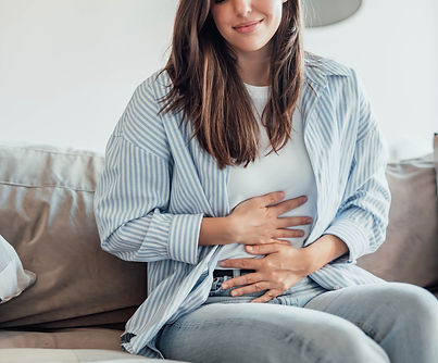 om stomachache alone at home, holding her belly, touching and massaging abdomen Bad sick f