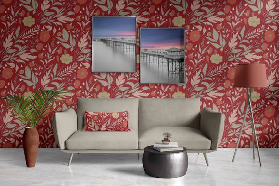 Vector illustration of stylised leaves and flowers in muted colours of orange, sage, pink in a repeat pattern on a dark orange background