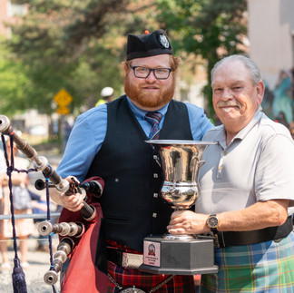 Bagpipe winning a trophy at the hamilton highland gathering