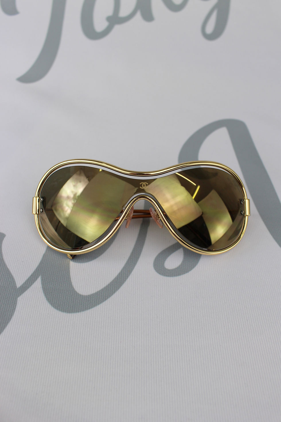 Thumbnail: Chanel Gold Floating Frame Shield Glasses
